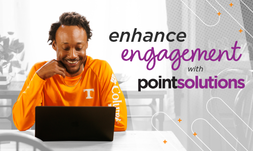 Man smiling, sitting at a table looking at a laptop; Enhance Engagement with PointSolutions