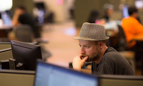 Student working at the computer lab in the commons