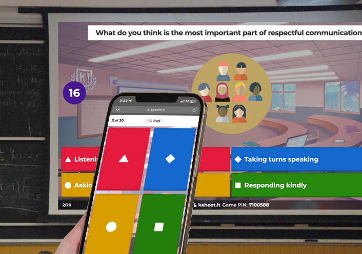 A kahoot is being projected on the screen and a user is holding an iPhone displaying the player screen.